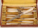 a box with a set of knives inside of it