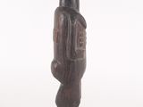 an image of a wooden statue of a man with a hat