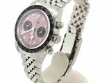 a watch with a pink dial on a stainless steel bracelet