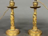 pair of antique brass candlesticks with figurines and chains