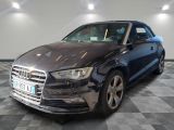 the audi audi is parked in a garage with a checkered floor