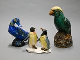 three figurines of birds sitting on top of each other