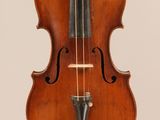 an old violin with a bow hanging from it ' s back