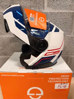 an orange and white box with a helmet on top of it