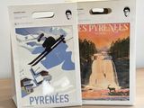 two boxes that have a picture of a person on skis on them