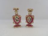 pair of pink and gold vases with flowers on them