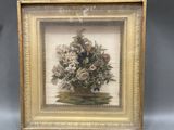 an old picture of a vase of flowers in a gold frame
