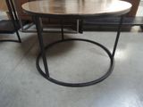 a round table with a wooden top and metal legs