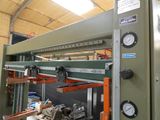 an image of a machine that is working on a piece of metal