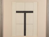 painting of a black cross on a white background in a black frame
