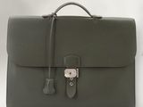 a close up of a briefcase on a table with a white background