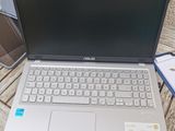 a laptop that is sitting on a table with a bag