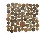 a close up of a pile of coins on a white surface