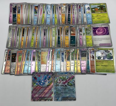 a lot of pokemon cards that are on the table