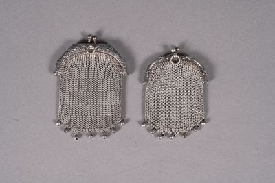 a pair of silver mesh earrings on a white surface