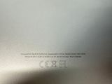 an image of a close up of the back of a silver cell phone