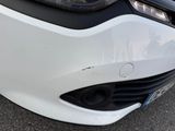 a close up of a car ' s front bumper and headlight