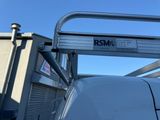 a truck with a metal ladder on the back of it