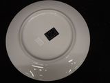 a white plate with a black label on it