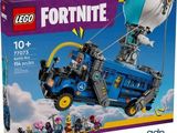 the box is full of legos with a blue and yellow vehicle
