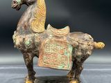statue of a horse with a saddle on it ' s back