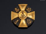 an image of a gold and black medal with a cross on it
