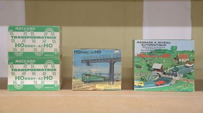 three books on a shelf with a train on it