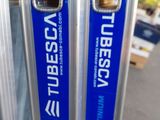 two blue and white signs on the side of a building