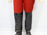 a mannequin dressed in a red uniform and black boots