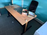 a desk with a chair and a book on it