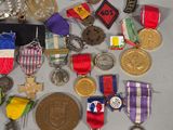 a lot of medals and medals on display on a table