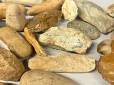 many different types of rocks on a white surface
