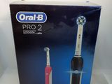 an image of a box of toothbrushes sitting on a white surface