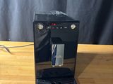 a coffee machine that is sitting on a wooden table