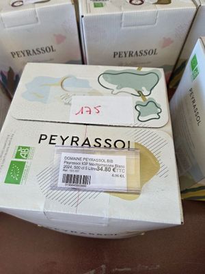 several boxes of peyrassol sitting on a table next to each other