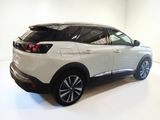 the rear end of a white suv parked in a white room