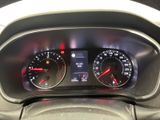 the dashboard of a car with two gauges and a clock on it