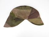 a camouflage hat on a white surface with a white background