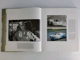 a book with a picture of a man in a racing car