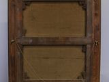 an old wooden easel with a painting on top of it
