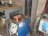 a machine that is sitting in a room with a lot of wires