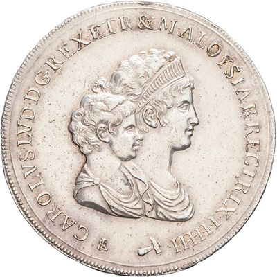 an image of a silver coin with a woman ' s head on it