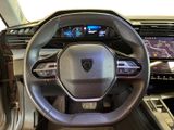 the interior of a car with a steering wheel and dashboard controls