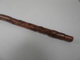 a wooden stick that has been carved into it