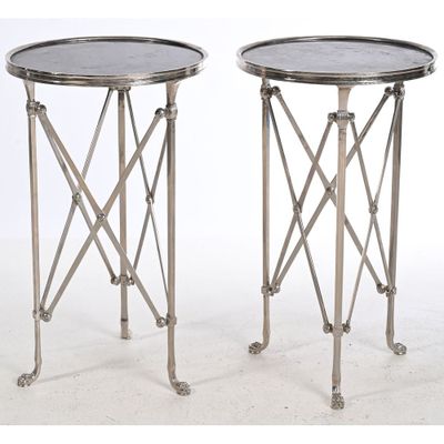pair of silver metal side tables on wheels with a marble top
