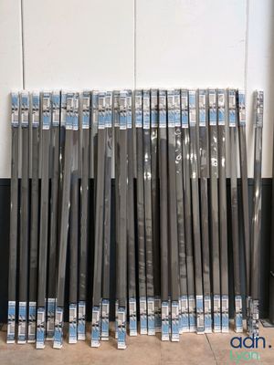 a lot of baseball bats lined up on the floor
