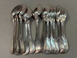 five spoons and a fork on a table