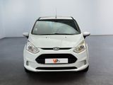 the front of a white ford fiesta parked in a white room