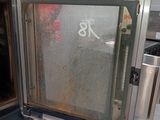 a large oven with a door open in a kitchen