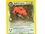 a close up of a pokemon card on a white surface
